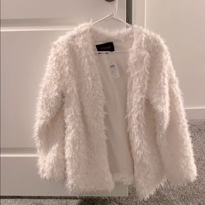 White faux fur coat